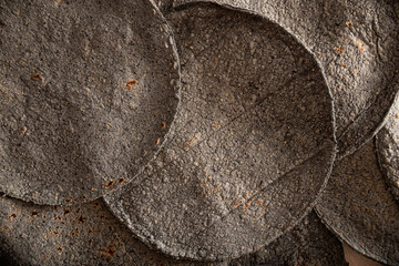 Blue Corn Tortillas. Food made with nixtamalized corn, a staple food in several American countries,...