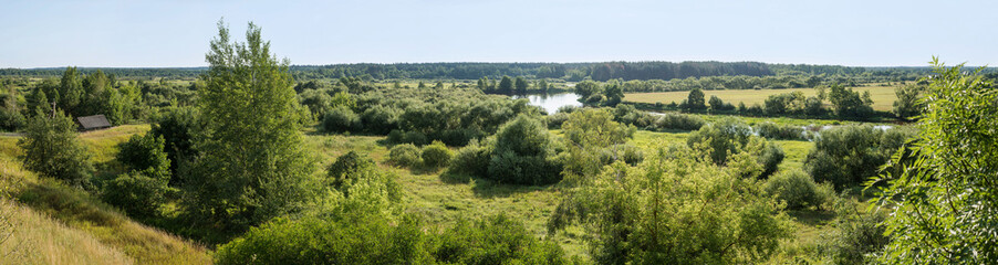 Fototapeta na wymiar Pastoral landscape on the banks of the river in Belarus