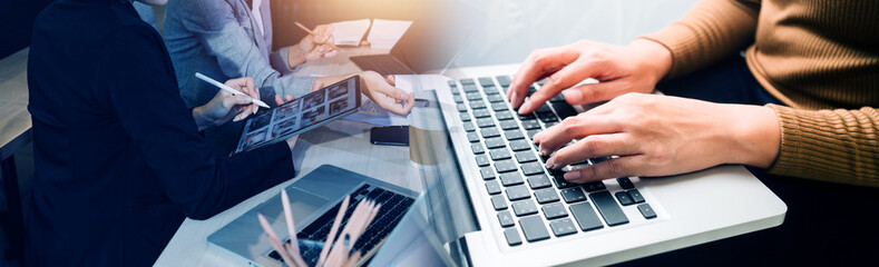 Business team finance or bookkeeper working with a calculator to calculate business data summary report, accountancy document and laptop computer at the office, business meeting concept