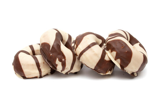 Donuts Covered With Chocolate And White Chocolate, Isolated In White Background. A Donut Has Approximately 300 Calories And 25 G Of Fat On Average.