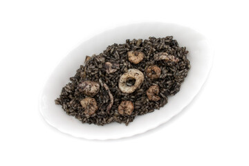 Black rice with squid and shrimp, on a plate, isolated on white background. Spanish food concept.