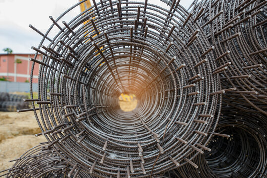 Stainless Steel wire Rolls in construction site. Closeup of Metal Steel reinforcement rod for concrete in store. Wire mesh places on floor ground. Construction site Concept.