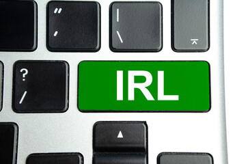 word irl on green keyboard button. Business concept