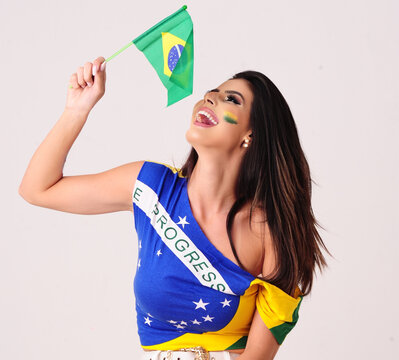 brazilian girl celebrating with the Brazil&acute; flag