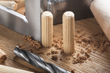 drill bit with steel triangle ruler make sink in hole for screw in wooden oak plank