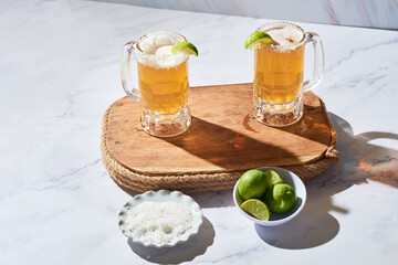 Chelada, beer cocktail with lemon and salt from Mexico.