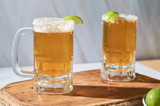 Chelada, drink prepared with lion beer and salt in Mexico. - Powered by Adobe