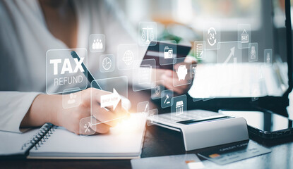 Concept of tax payment optimisation business finance,Man using calculator and taxes icon on technology screen,income tax and property, background for business, individuals and corporations such as VAT