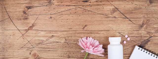 women health, middle age and menopause concept. health care style. copy space. white plastic bottle...