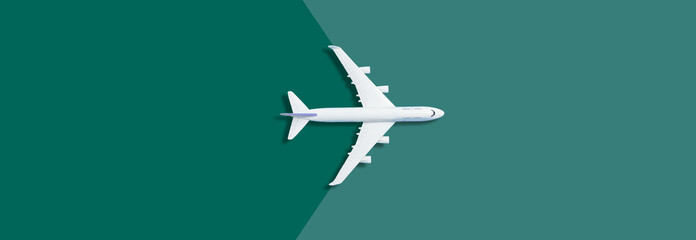 Flat lay design of travel concept with plane on blue background with copy space © Angelov
