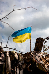 The flag of Ukraine flies over Ukrainian positions in the combat zone. War in Ukraine.
