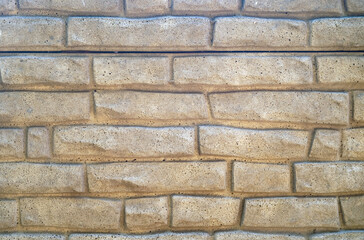Background texture of stone - brick decoration of the facade of the building.