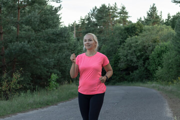 a young girl runs in the woods Doing sports Healthy lifestyle