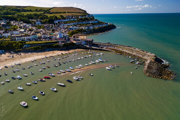 Aerial view of boats and the beach at the colorful Welsh seaside town of New Quay in Cardigan Bay