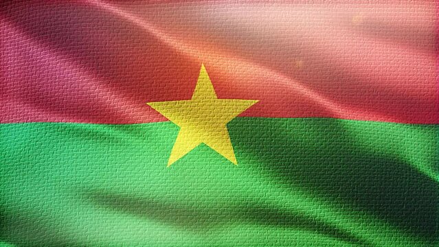 Flag of Burkina Faso. Beautiful detailed texture fabric waving in the wind.
