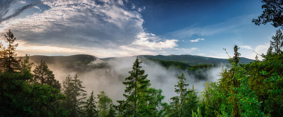 Panorama of the Karkonosze Mountains in Poland at dawn.