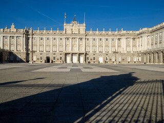 Fototapeta na wymiar Madrid Royal Palace Plaza de la Armeria with gate shadow projected on the ground