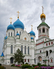 Fototapeta na wymiar Nikolo-Perervinsky Monastery. Iversky Cathedral and the Bell Tower of St. Nicholas Cathedral 