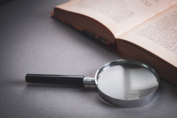 magnifier and book on the table