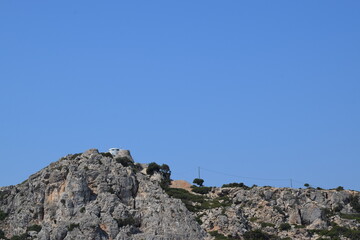 person climbing up the mountain