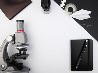      Creative trendy minimalist school or office workspace with black materials on a white...