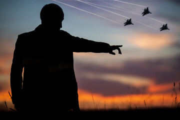 Silhouette of fighters and a man who points forward with his hand to attack. The politician who...