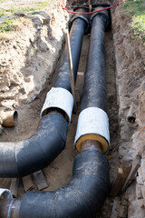 Large water and sewer a new tube pipe at construction site, stacked pvc plastic pipe. Engineering communication system construction.
