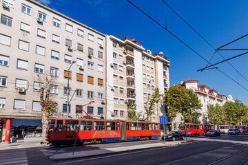 Plakat A tram psses through central Belgrade, Serbia