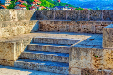 Stone bench at Mehmed pasha Sokolovic bridge in Visegrad, Bosnia and Herzegovina.