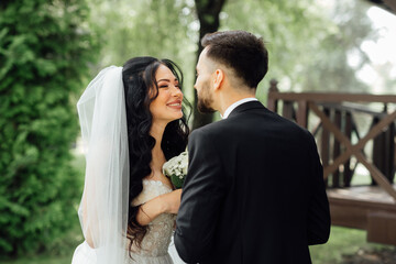 Amazing wedding couple. Beautiful bride and stylish groom
