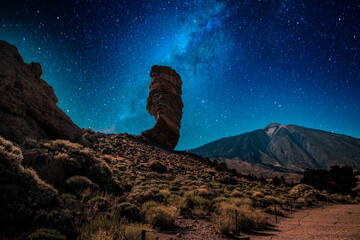 roques de Garcia stone and the milky way Teide mountain volcano in the Teide National Park ...