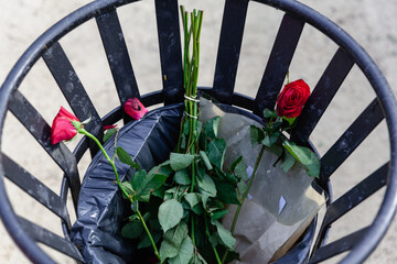 Roses flowers in the bin trash love rejection