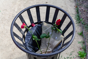 Roses flowers in the bin trash love rejection