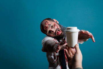 Aggressive halloween corpse wishing to drink coffee cup in studio, going after beverage and wanting...