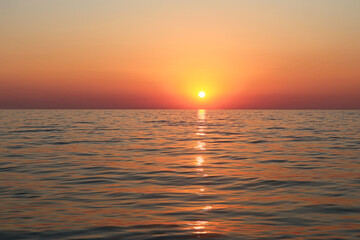 Picturesque orange sunset on the sea coast of Italy, Calabria