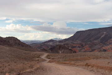 Overcast view of Kingman Wash trail dirt road leading to Fortification Hill ancient volcano within Lake Mead recreation area August 2022