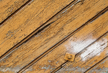 The background, old wooden boards with shabby paint and white spots. Photo of old boards located at an angle.