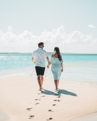 Couple walking on the beach. Exuma, Bahamas