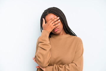 black young adult woman looking stressed, ashamed or upset, with a headache, covering face with hand