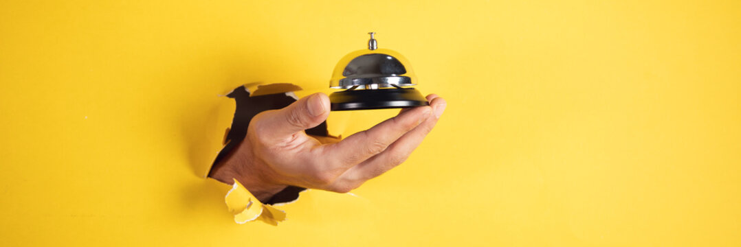 male traveler hand bell to call