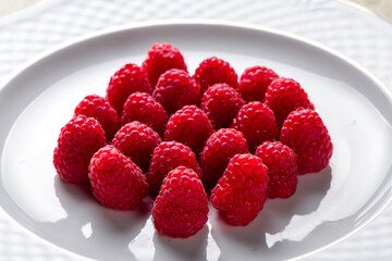 raspberry berries on plate close up macro