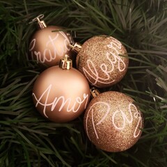 Christmas balls decorated with words. Gratitude, Love, Joy, Peace. Gratid&atilde;o, Amor, Alegria, Paz.
