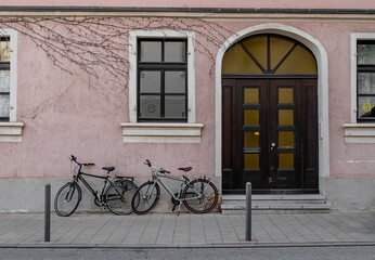 Fototapeta na wymiar mild pinky wall and street bikes