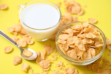 Cornflakes with milk on dark background, cornflakes bowl breakfast food and snack for healthy food concept, morning breakfast fresh whole grain cereal
