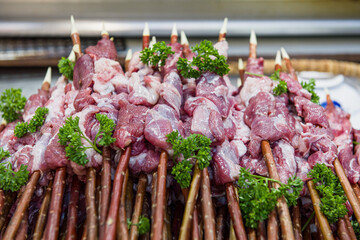 Raw lamb meat skewered, Preparing cooking on skewers.