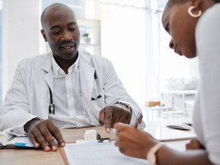 Doctor, patient and signing insurance paper while talking and pointing at consent form in clinic, hospital and health center. Consulting, medical checkup and medicine research with healthcare worker