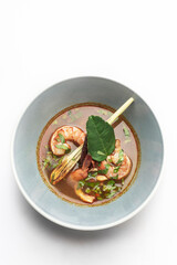 thai tom yam kung spicy soup with prawns on white background