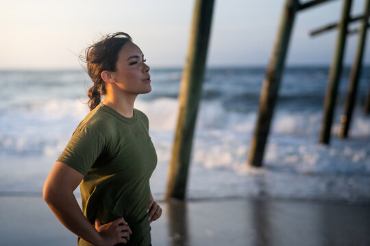 Marine veteran trains every morning on the beach to stay in shape just like when she was on active duty.