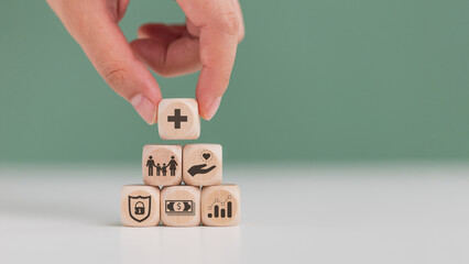 Insurance concept. Woman hand putting health care protection on the top of package insurance icons:...