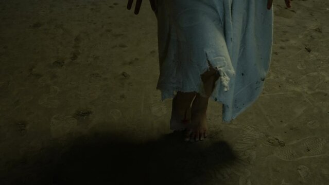 The ghost women legs walked in the wasteland in a dark, scary place with bloodstains.